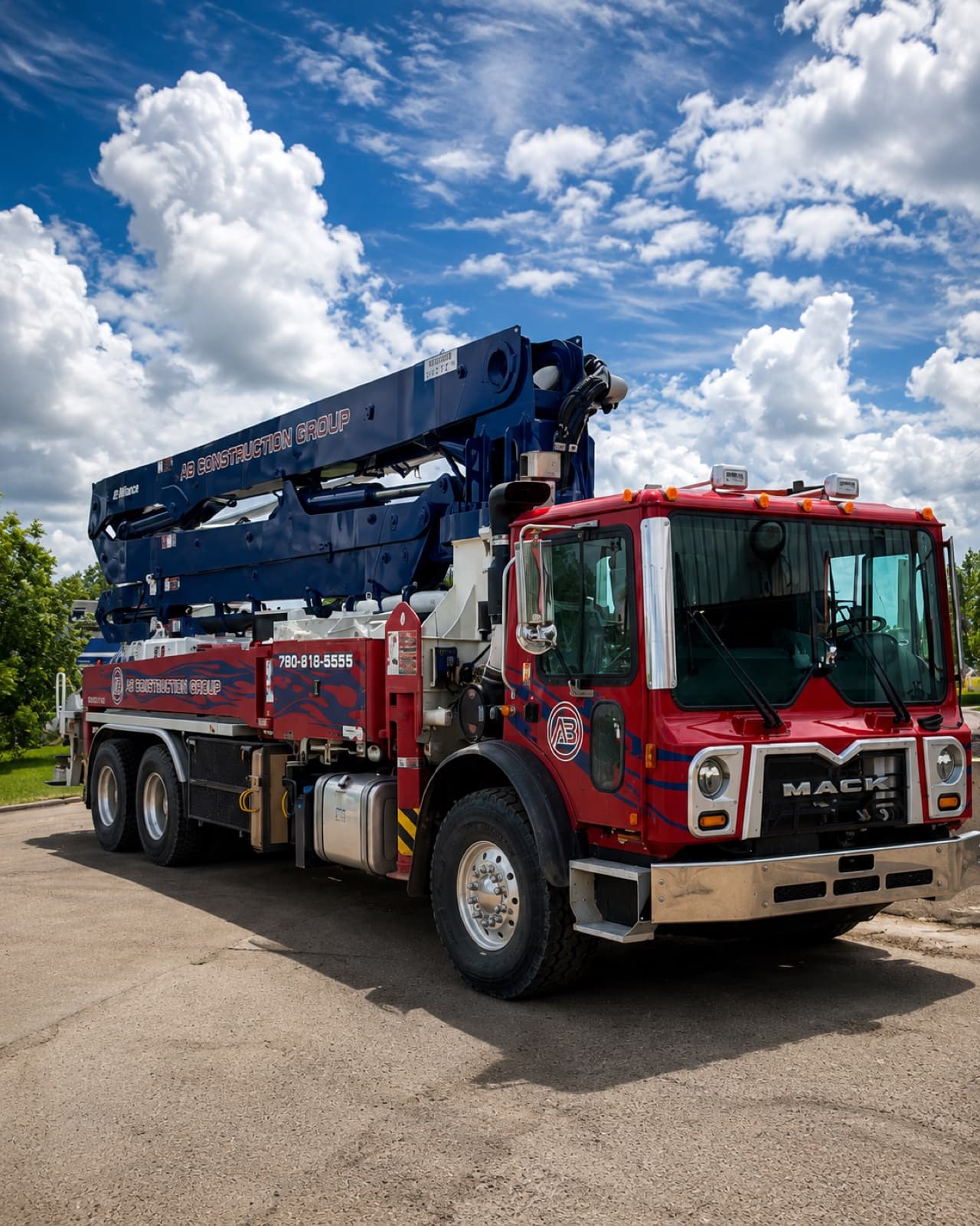 AB Construction Group boom pump truck ready for a concrete pour