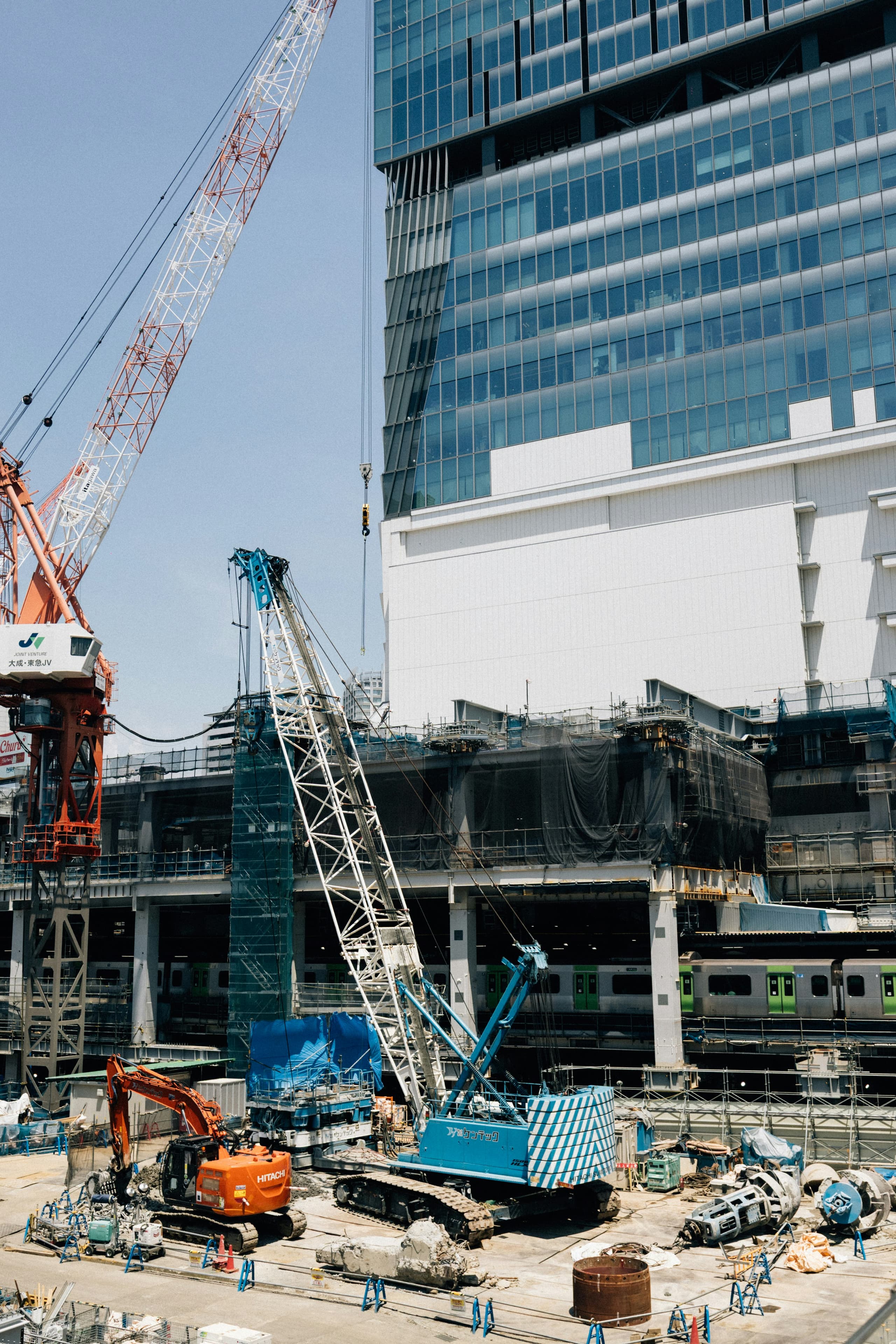 Cranes and heavy equipment on an active construction site