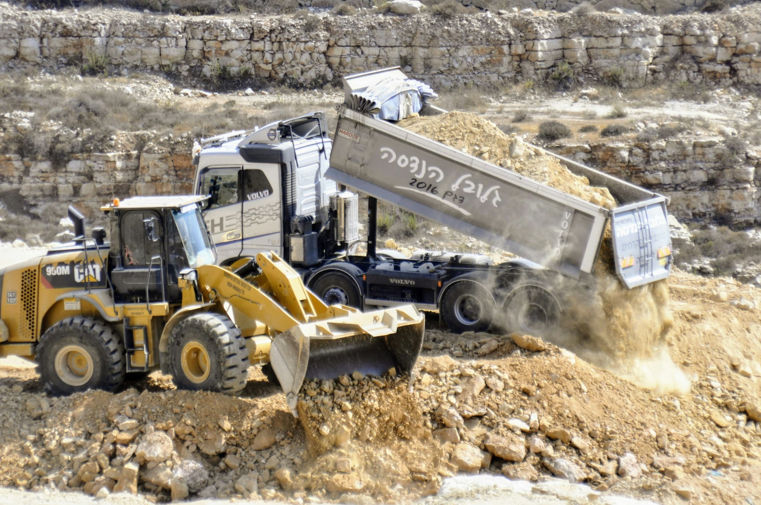 Dump truck moving material on a construction site