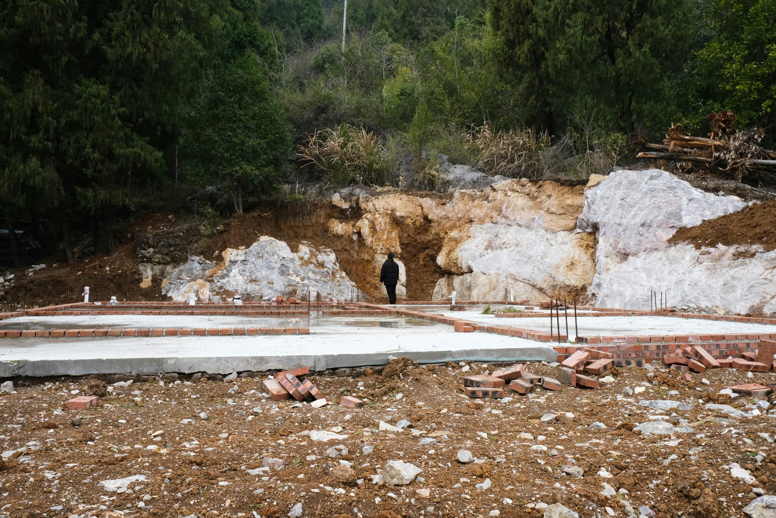 Crew preparing and checking foundation forms