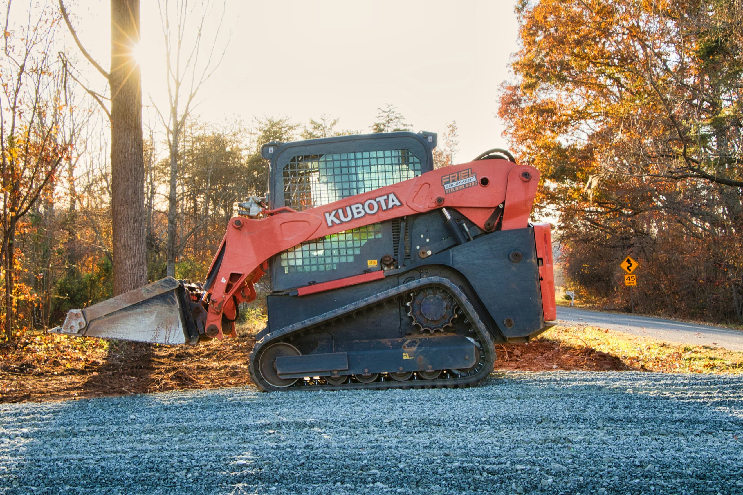 Excavator and truck working on a prepared construction site